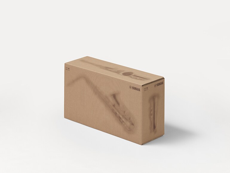 Yamaha cardboard shipping boxes with printed silhouettes of musical instruments.