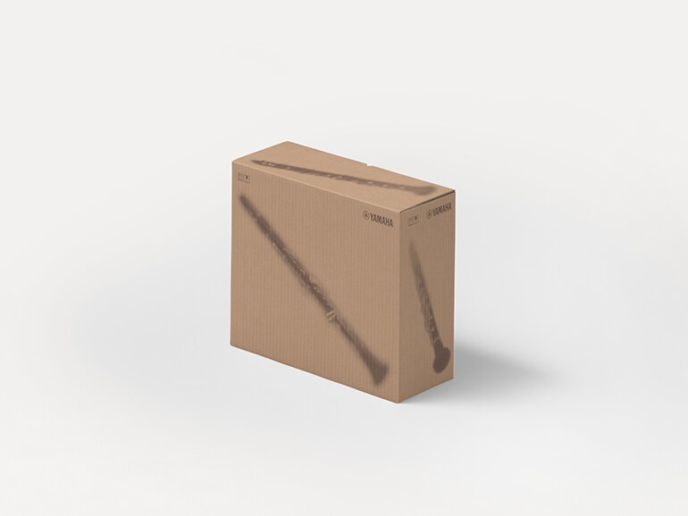 Yamaha cardboard shipping boxes with printed silhouettes of musical instruments.