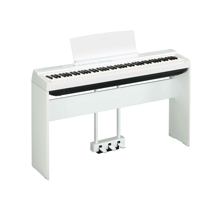 Diagonal side view of the P-125aWH (white model) in combination with the optional stand and three-pedal pedal unit