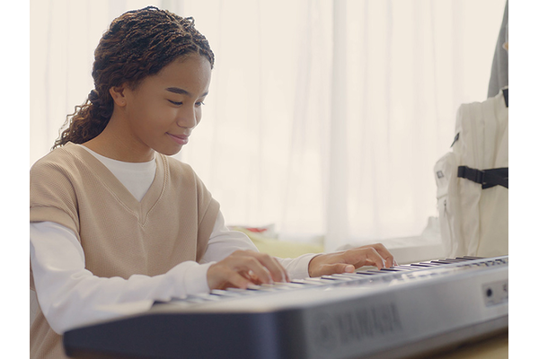 Girl practices Auto Chord Play.