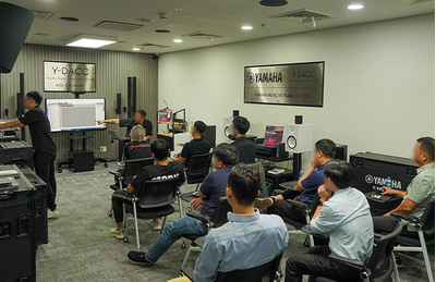 Ho Chi Minh City training facility with attendees seated during an audio training session.
