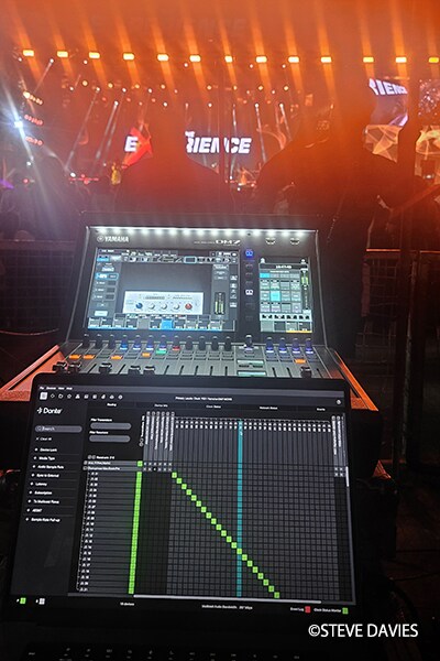 Yamaha DM7 digital mixing console and laptop running Dante Controller software at the front-of-house position during The Experience 2025 in Lagos, Nigeria.